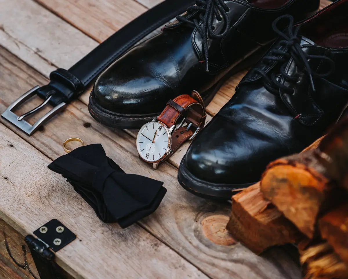Black leather dress shoes with laces and a polished finish.