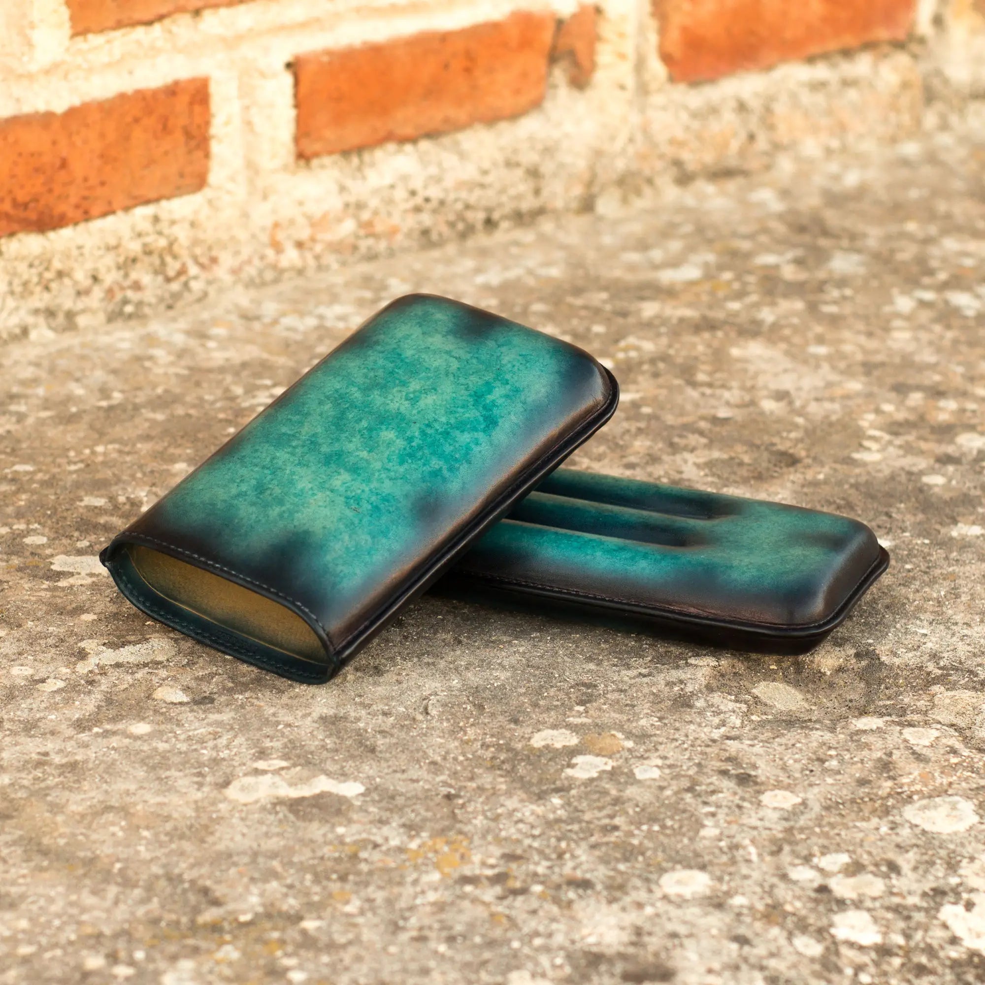 Turquoise leather cigar cases.