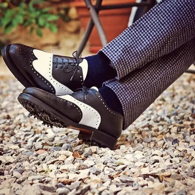 Two-tone golf shoes.