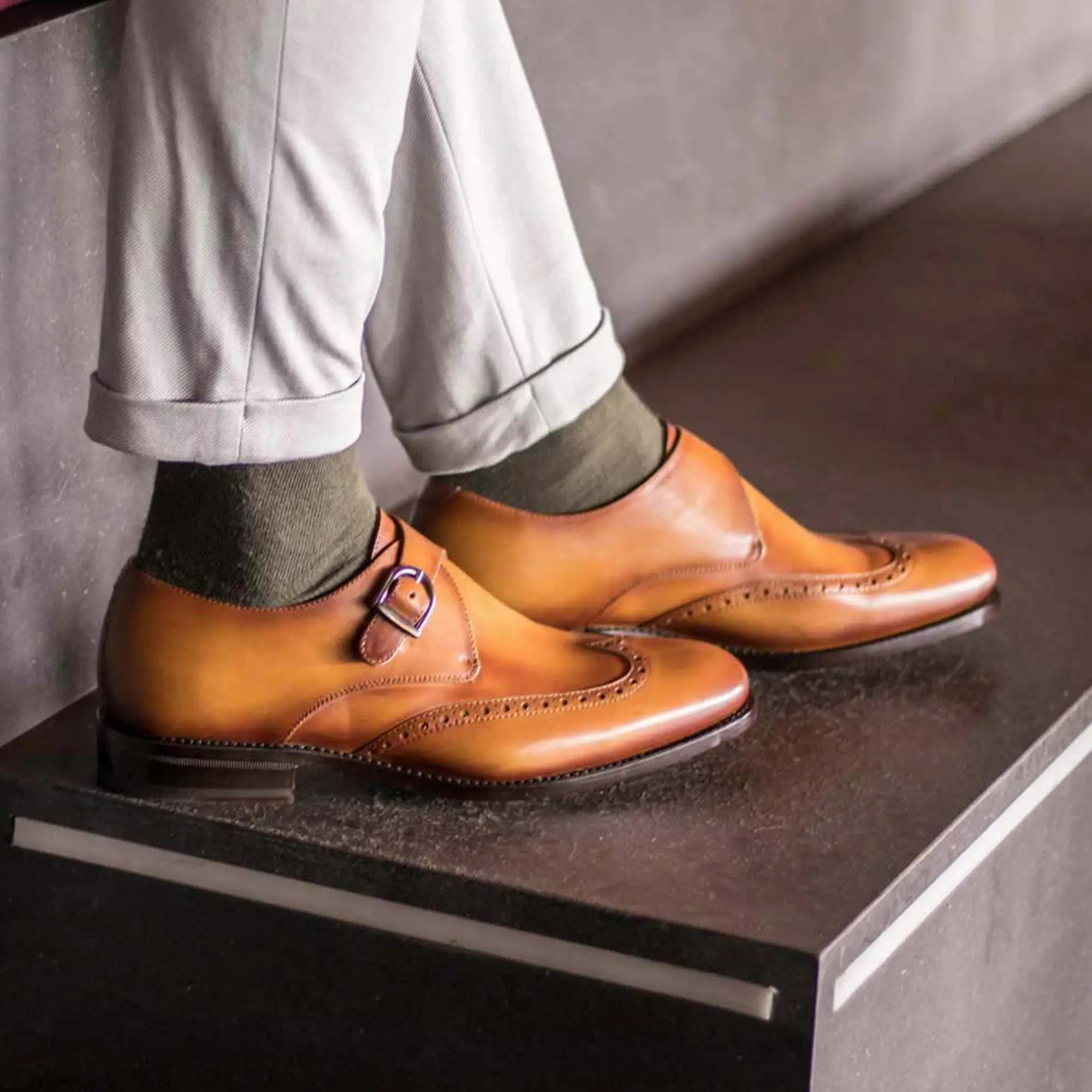 Pair of brown leather monk strap shoes.