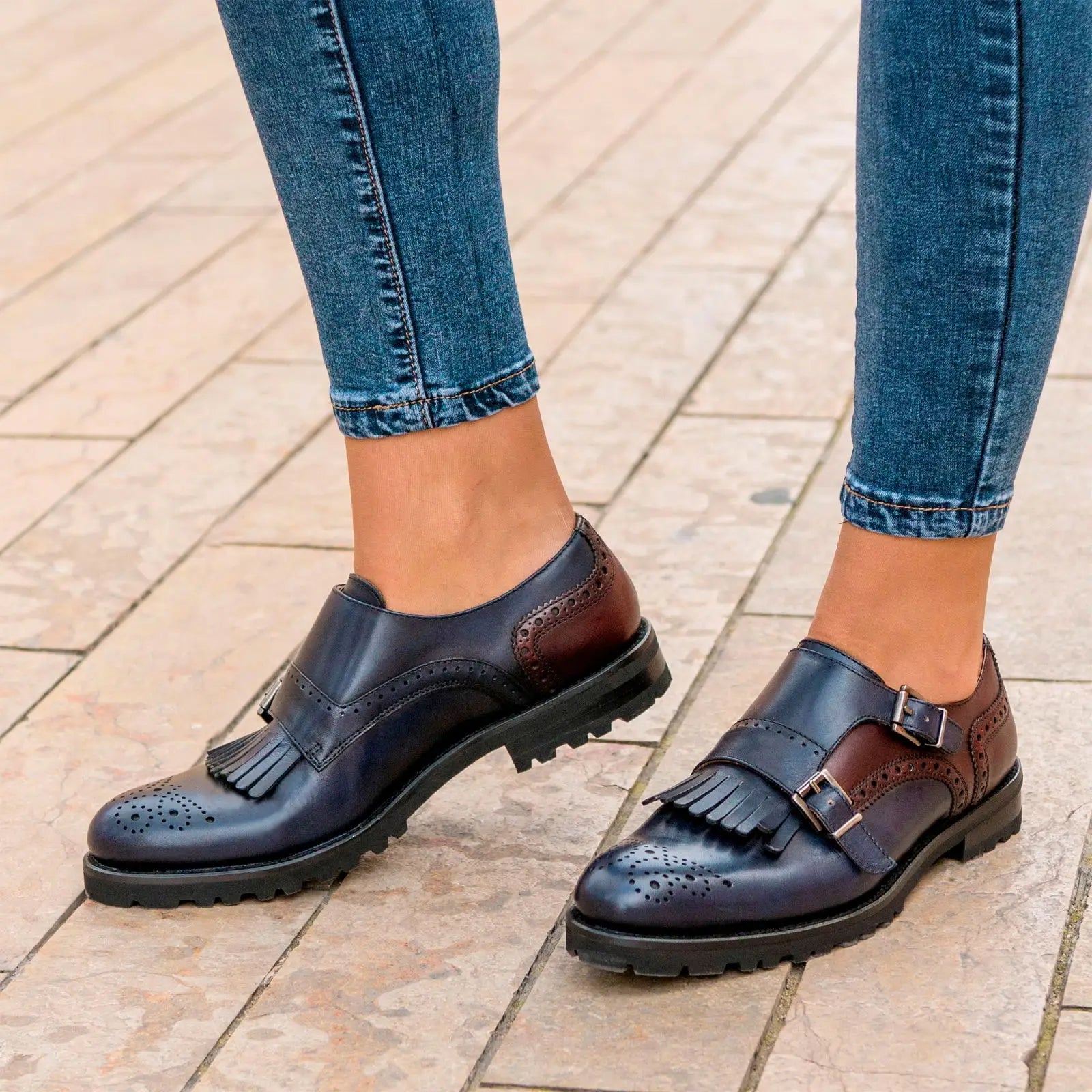 Two-tone leather monk strap shoes.