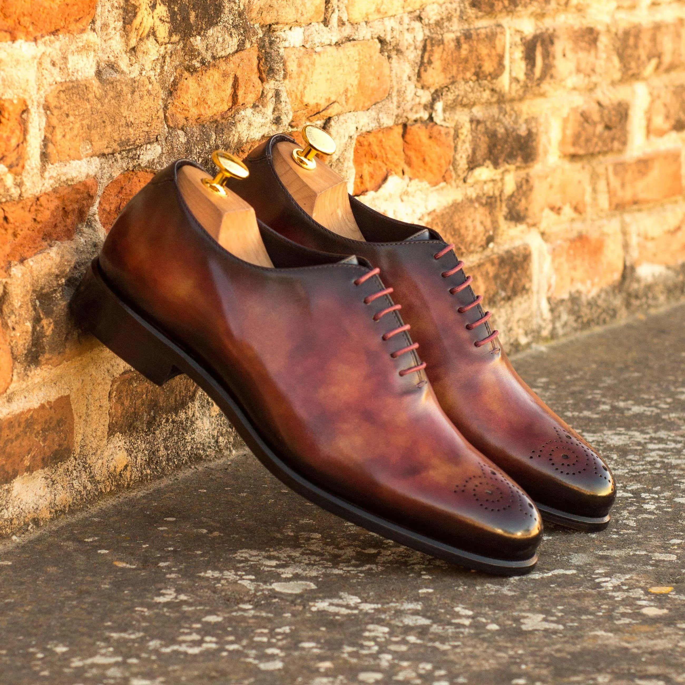 Pair of brown whole cut patina II luxury bespoke shoes for men