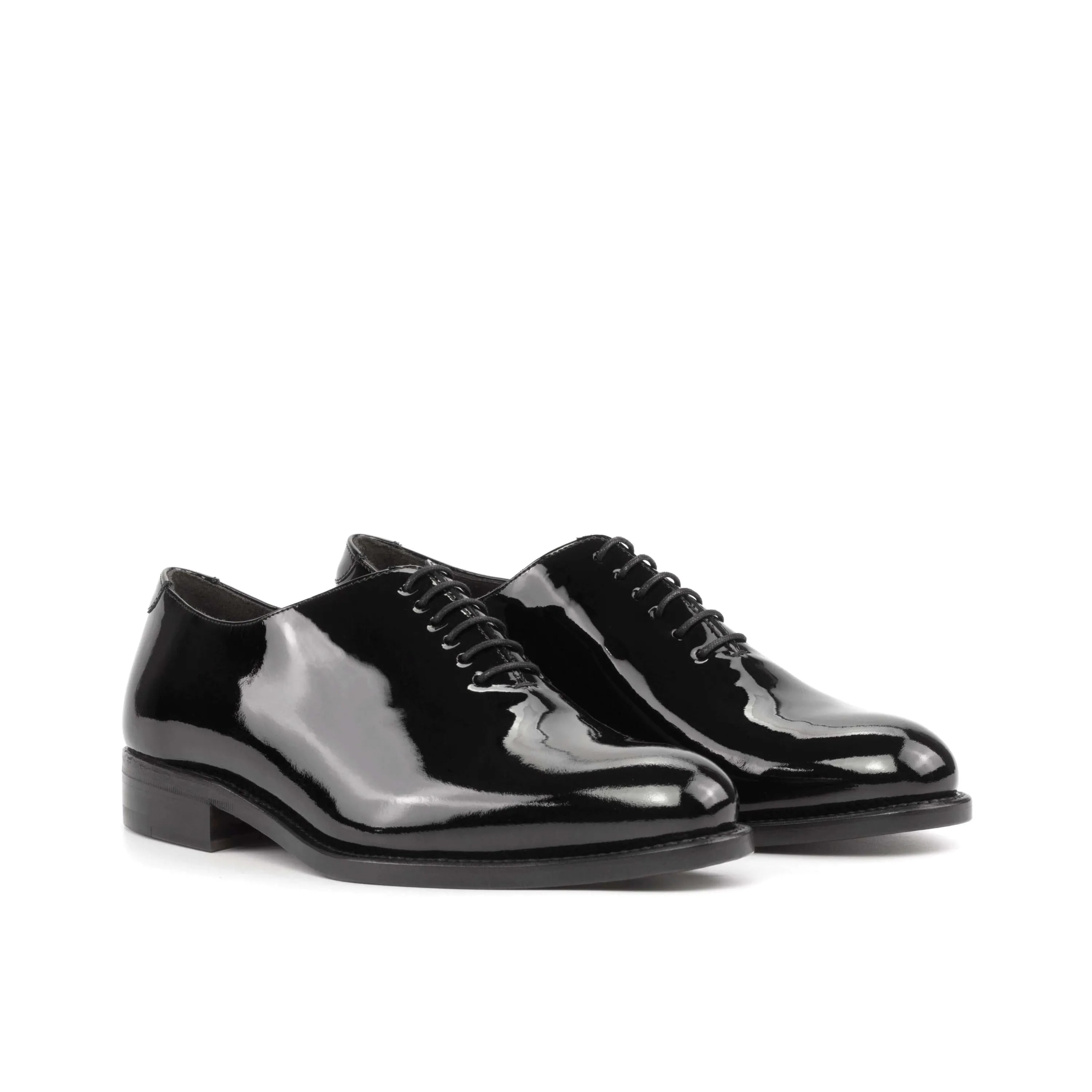 Shiny black Agent Wholecut shoes pair, rear view