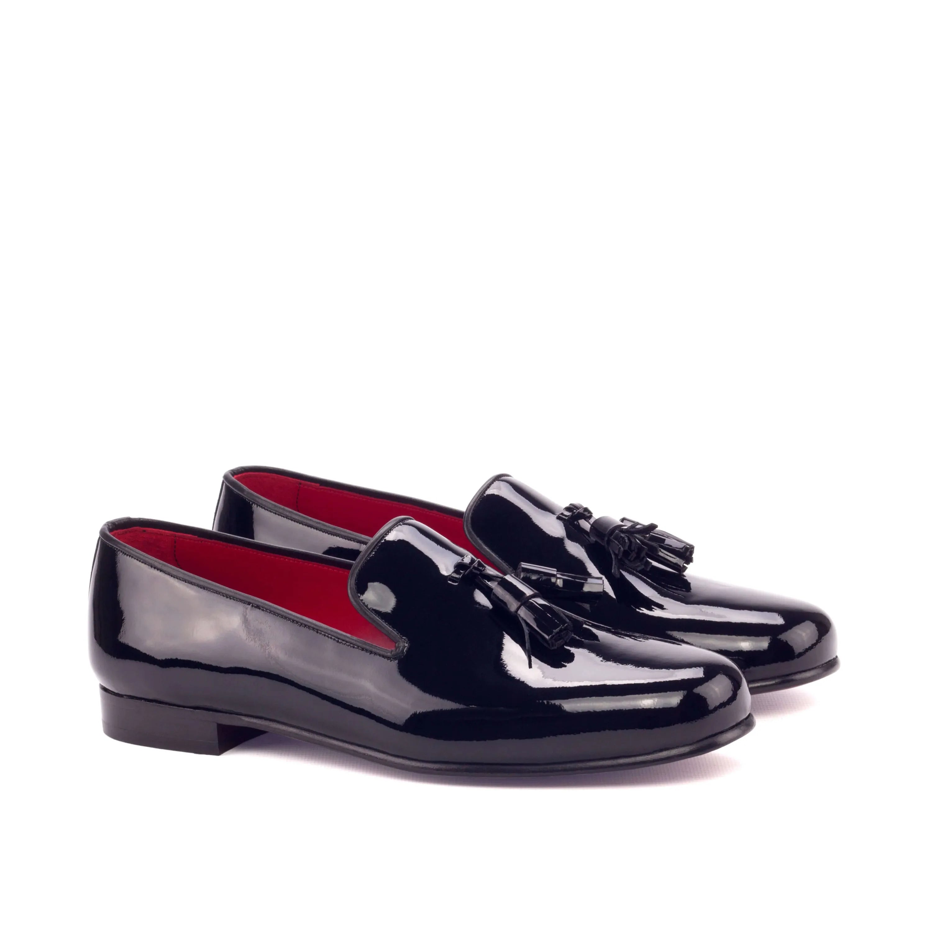 Pair of shiny black tassel loafers on Amuso Wellington slip