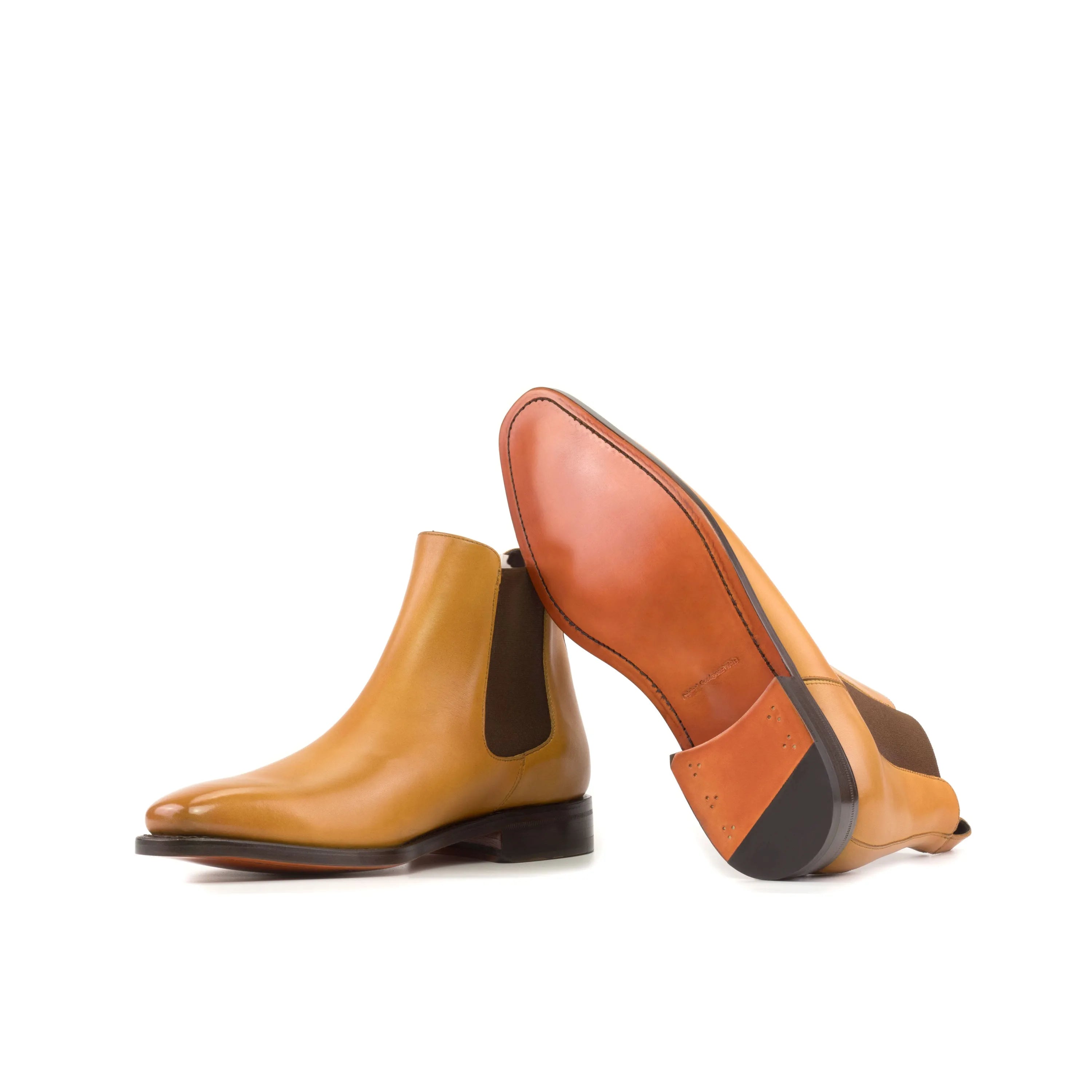 Pair of tan leather Canni Chelsea Boots in fast lane style