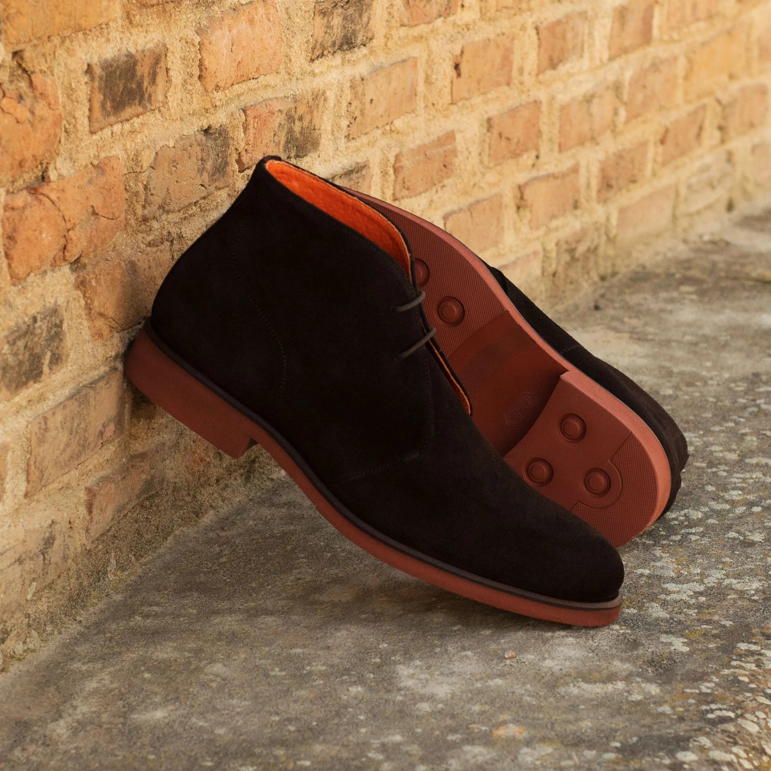 Demothi chukka boots in black suede with red soles