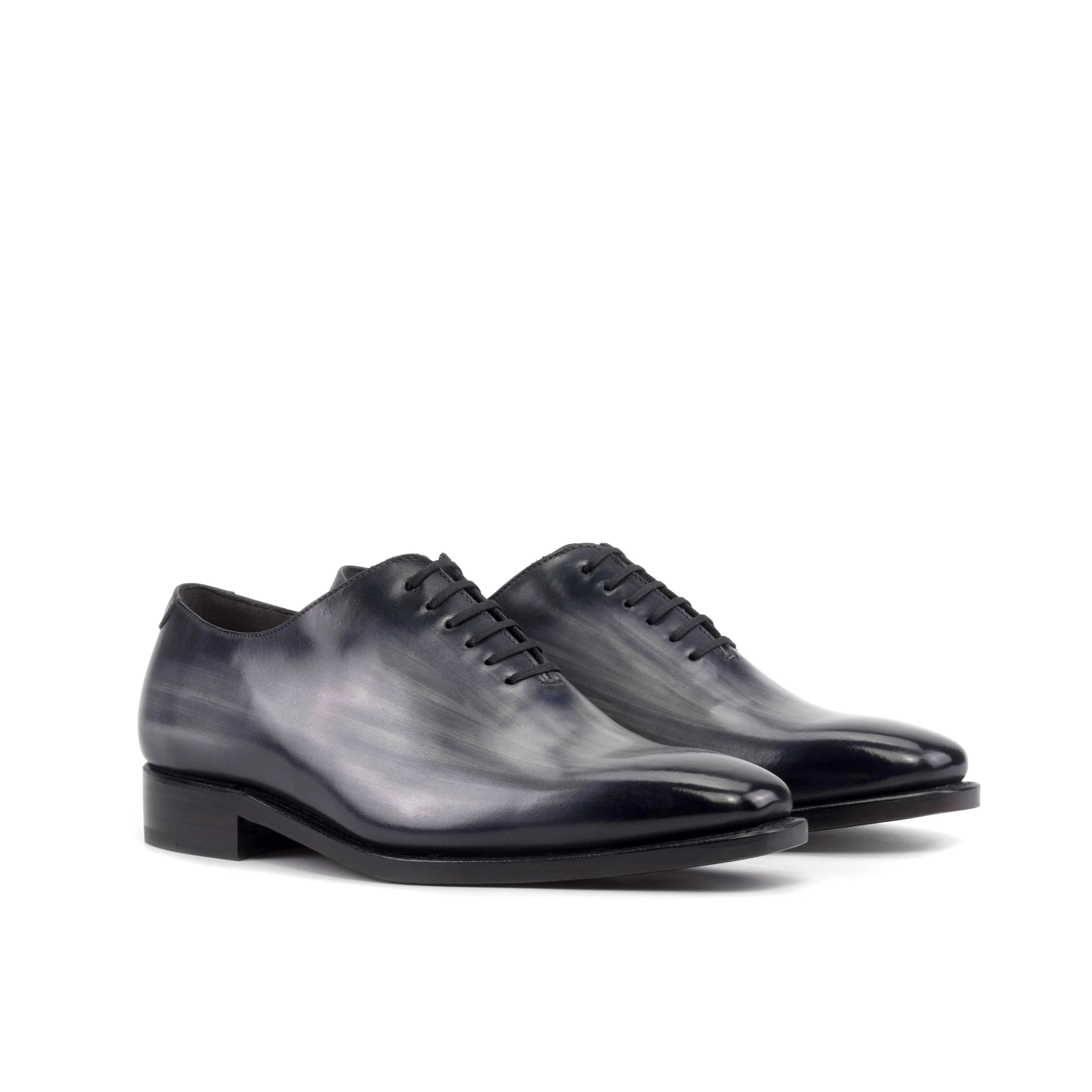 Pair of gray leather Eclipse Patina Wholecut shoes
