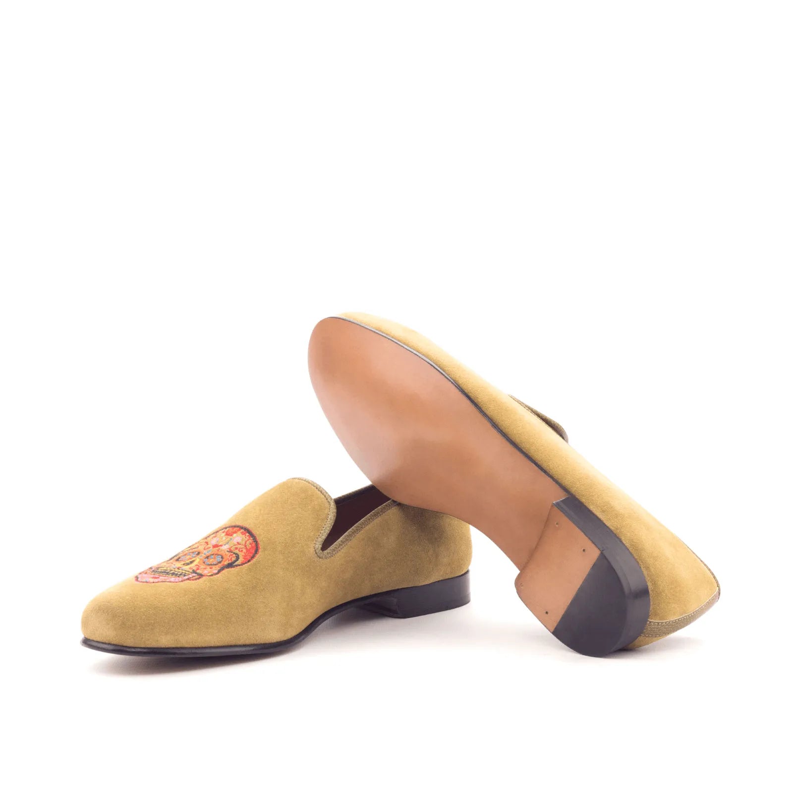 Tan suede Mizrable II Wellington slip on loafers with skull design