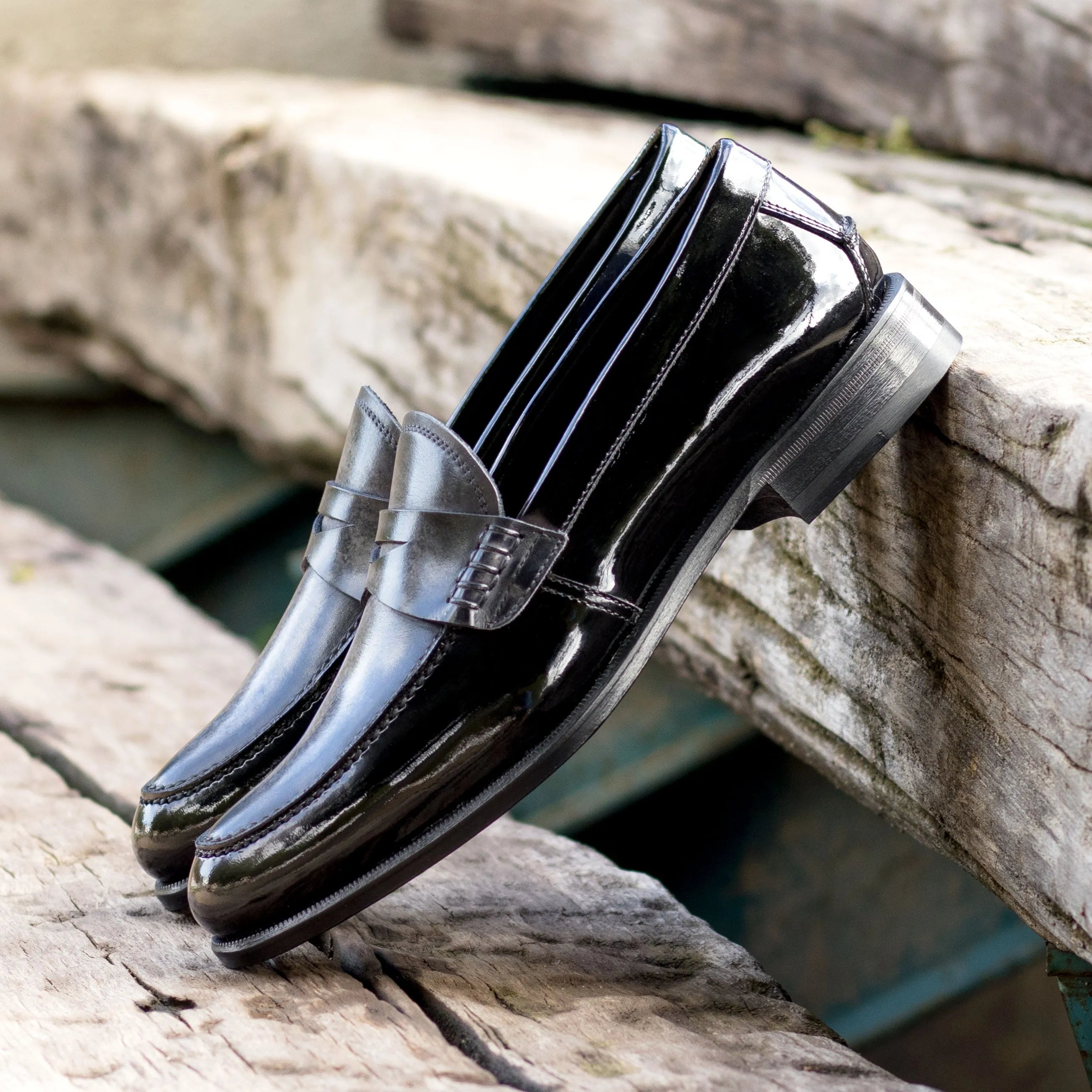 Titani unisex patina loafers: pair of shiny black loafers