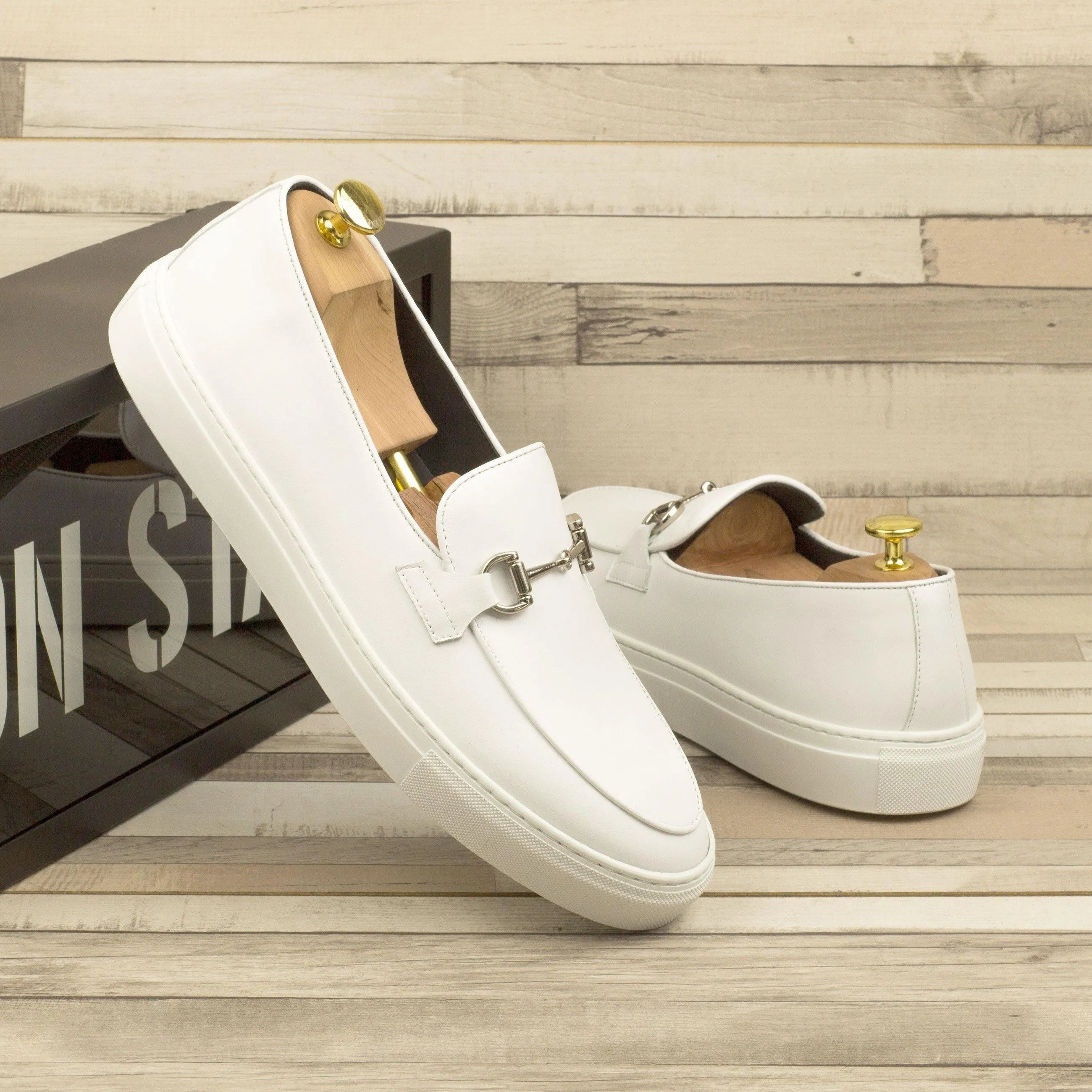Pair of white leather Tony Belgian sneaker II loafers