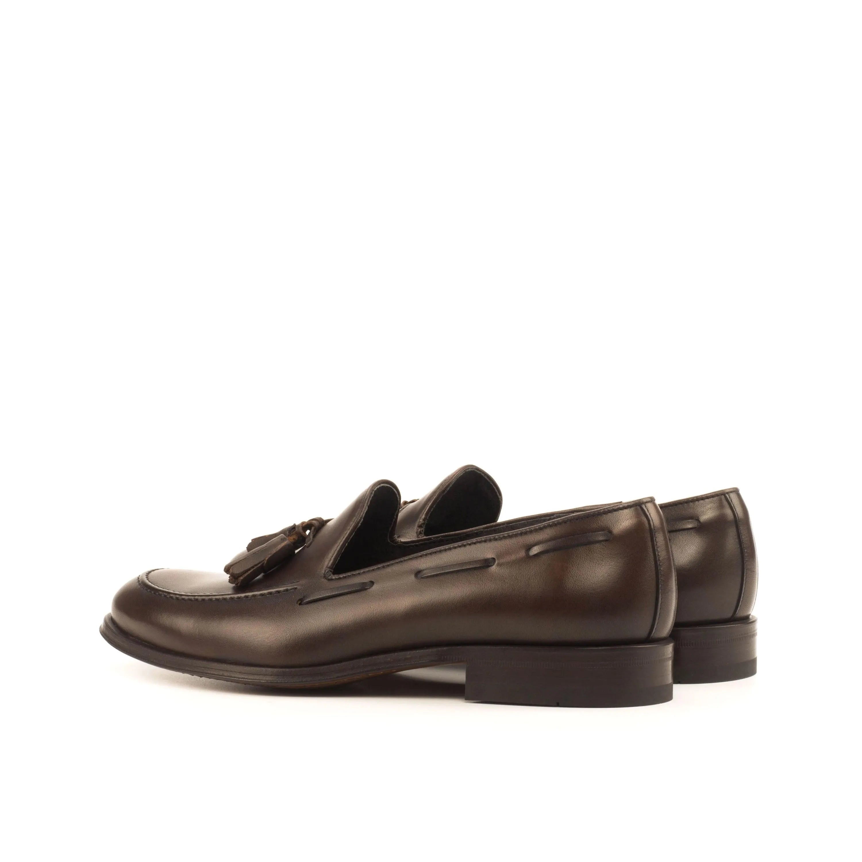 Dark brown Wachiwi Loafers II with rounded toe and leather tassels