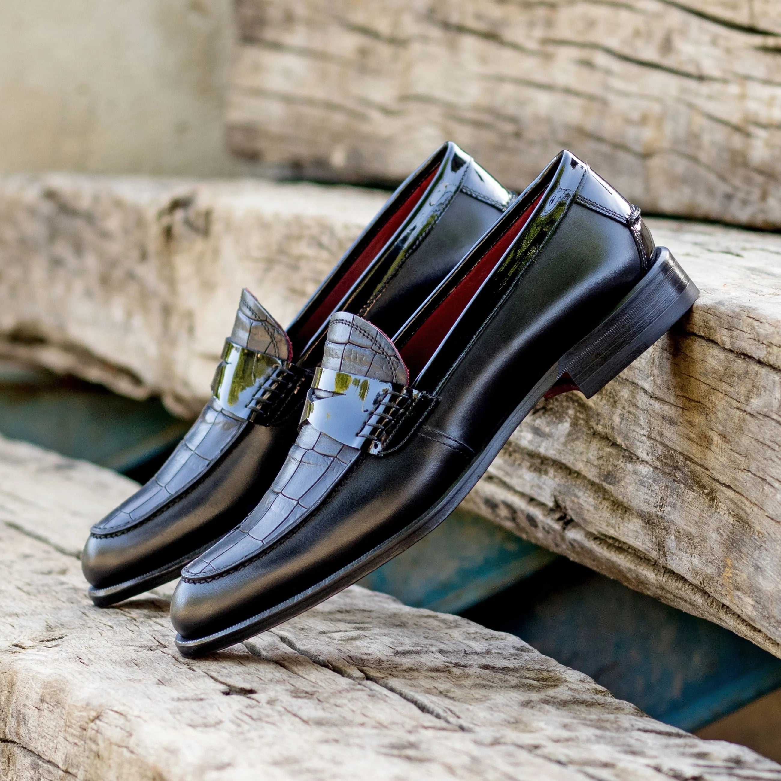 Pair of black leather XO unisex loafers