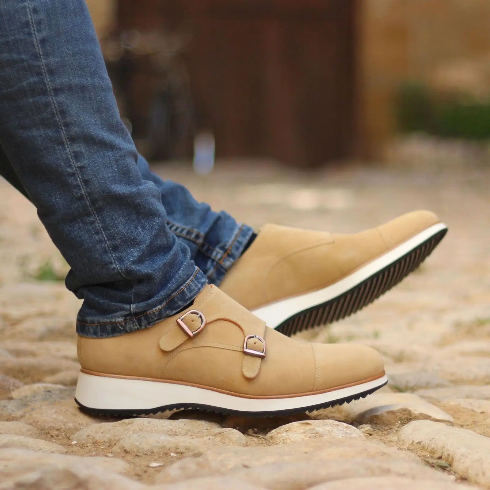 Tan double monk strap shoes.