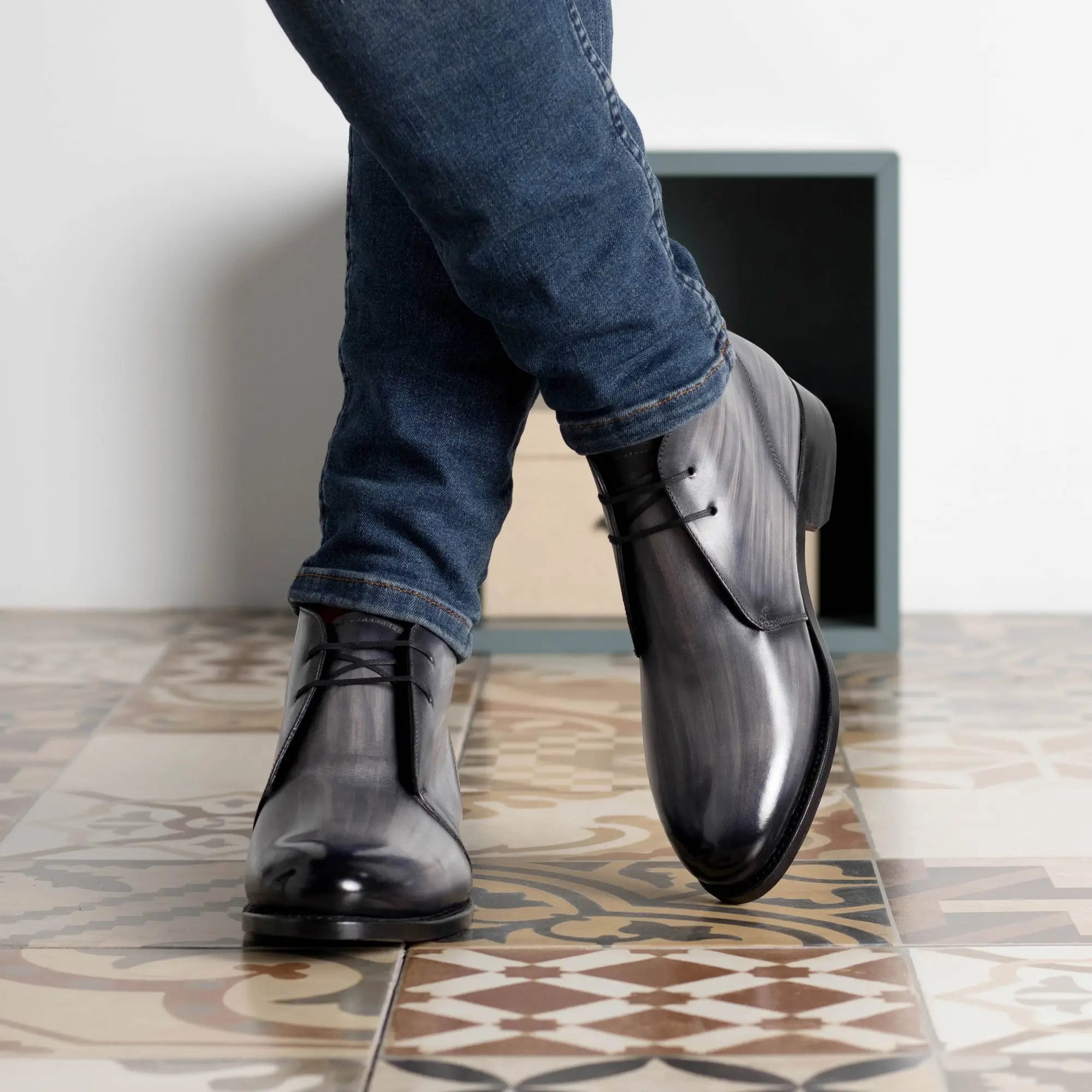 Gray leather lace-up boots.