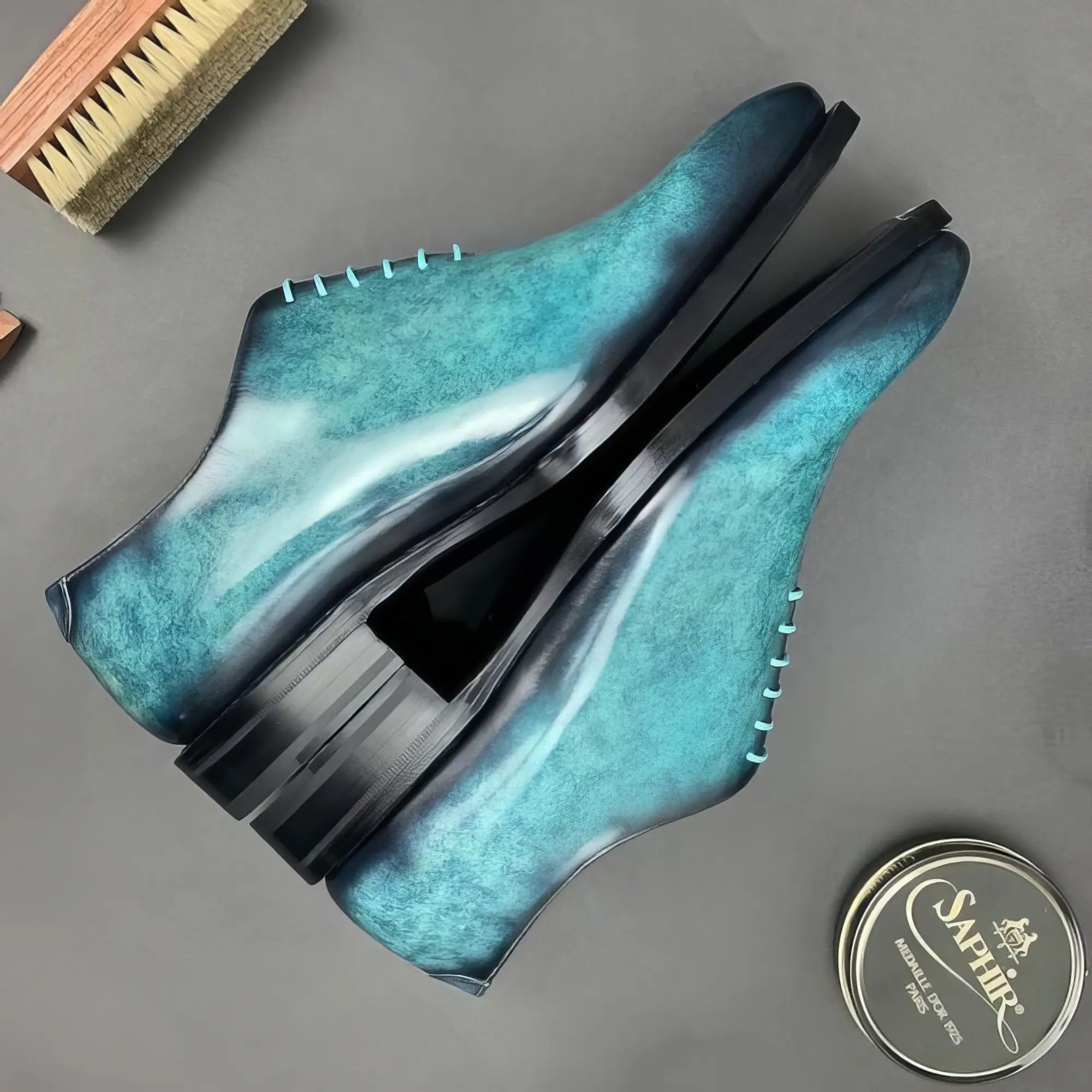 Turquoise leather dress shoes.