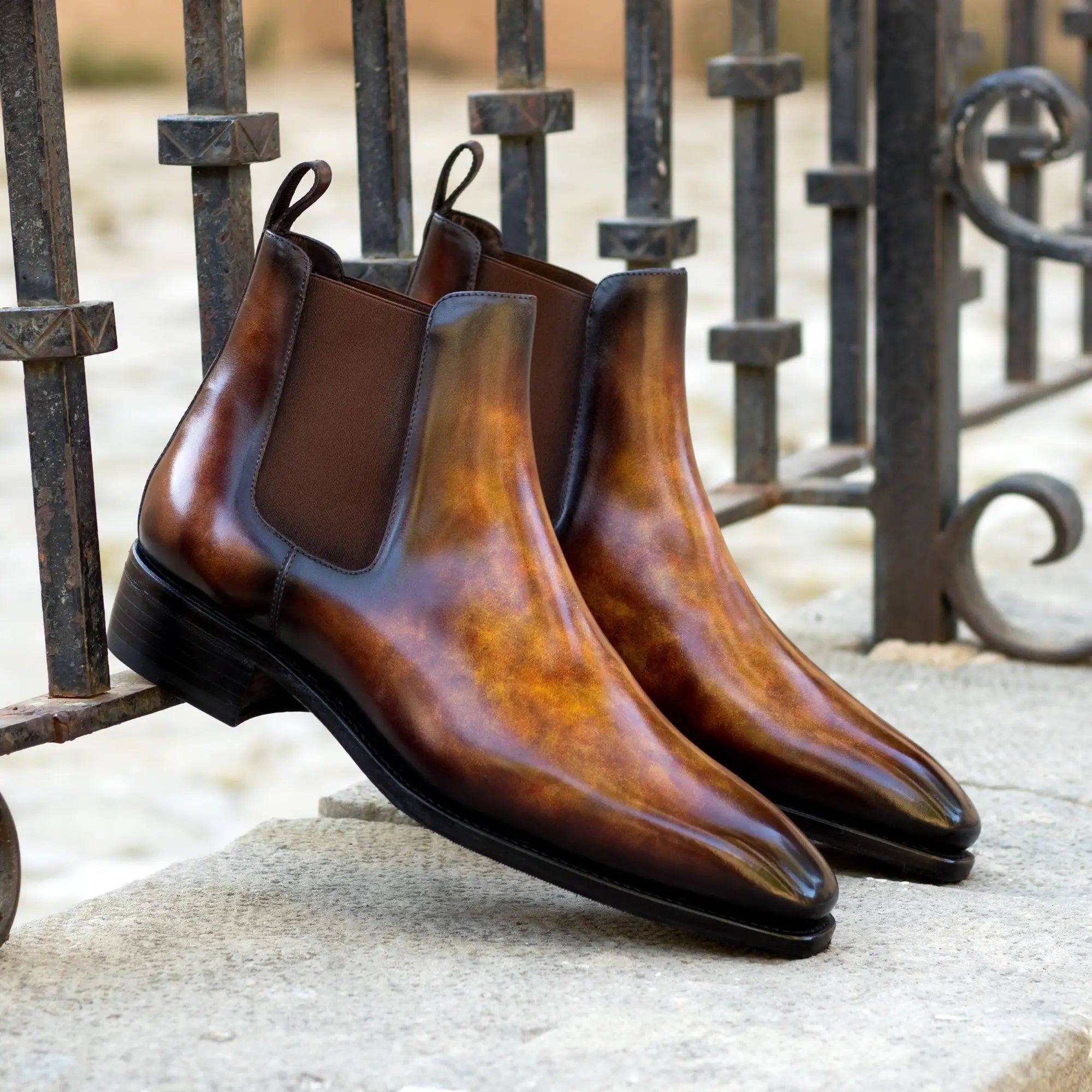 Brown leather Chelsea boots.