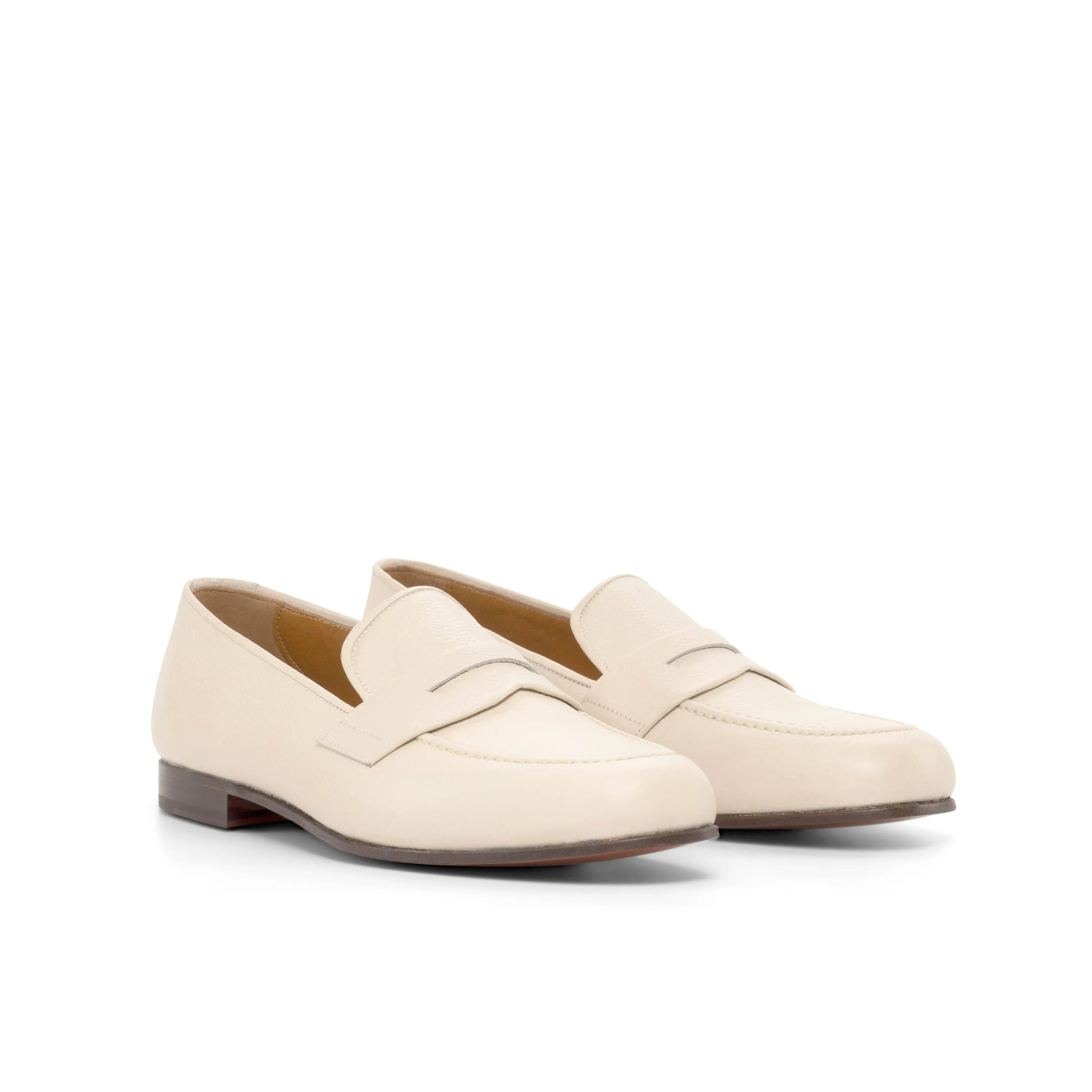 Pair of cream-colored leather Olgo Wellington slip-on loafers