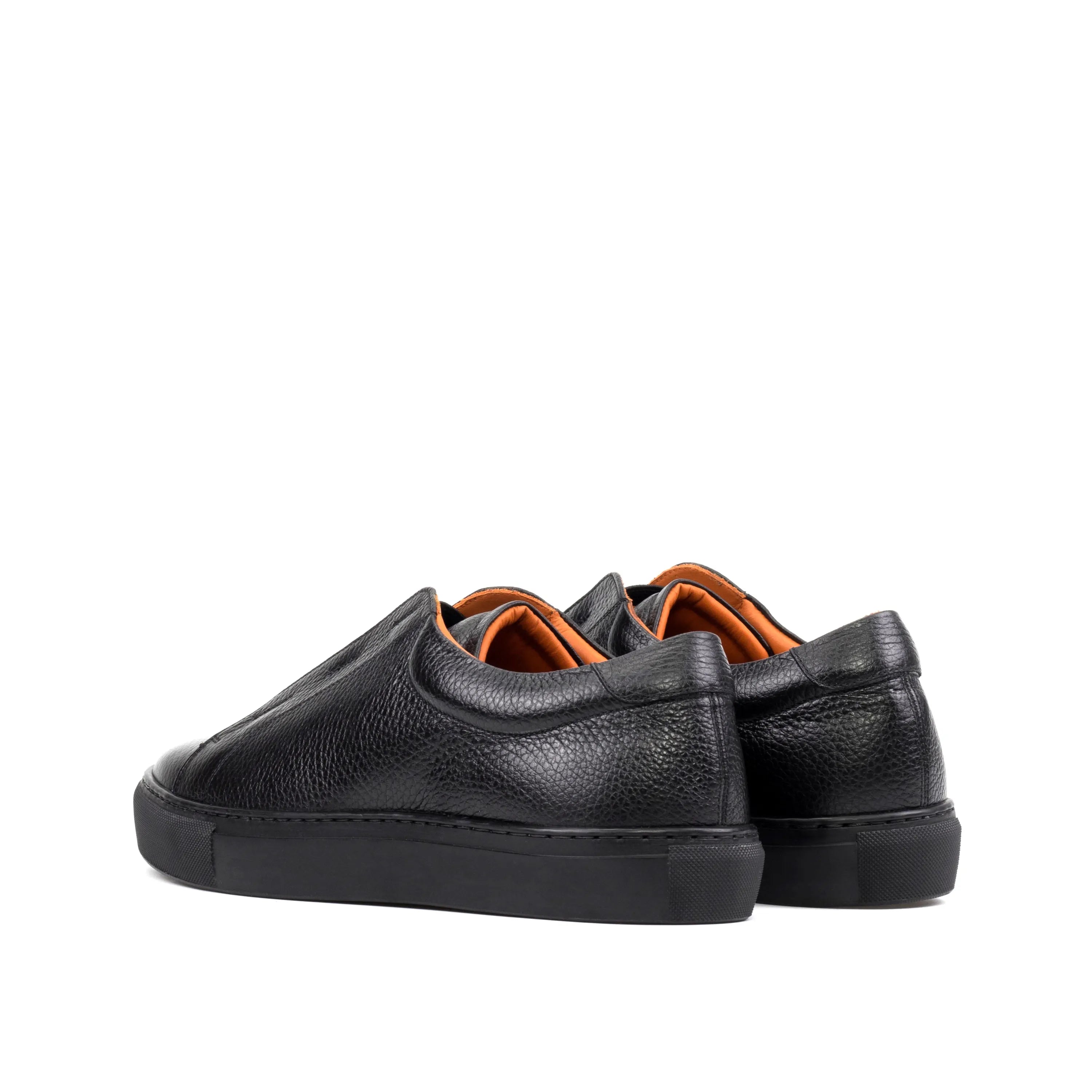 Pair of black leather Ordogan laceless sneakers