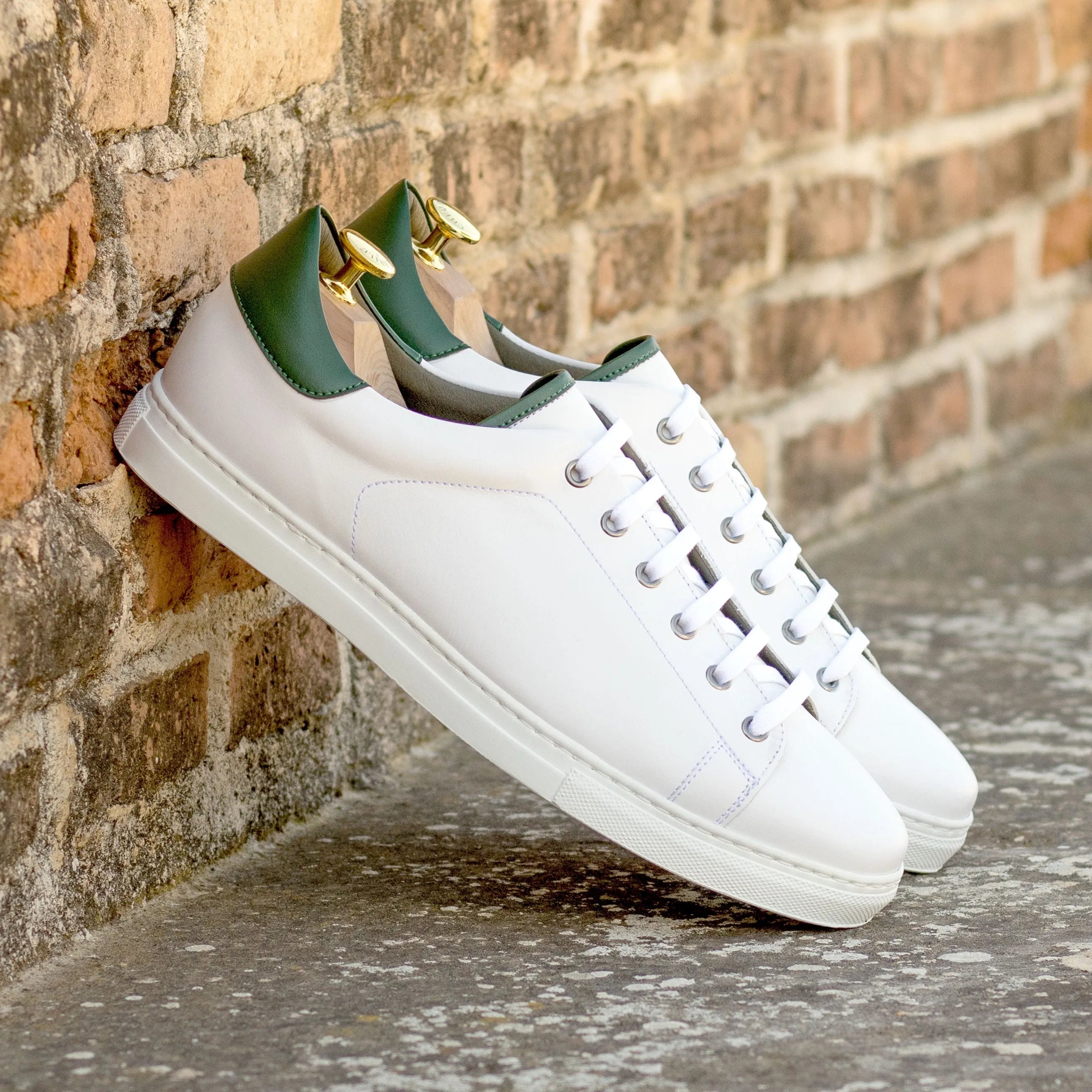 Back view of Ramirez Vegan Trainer in white leather with green heel