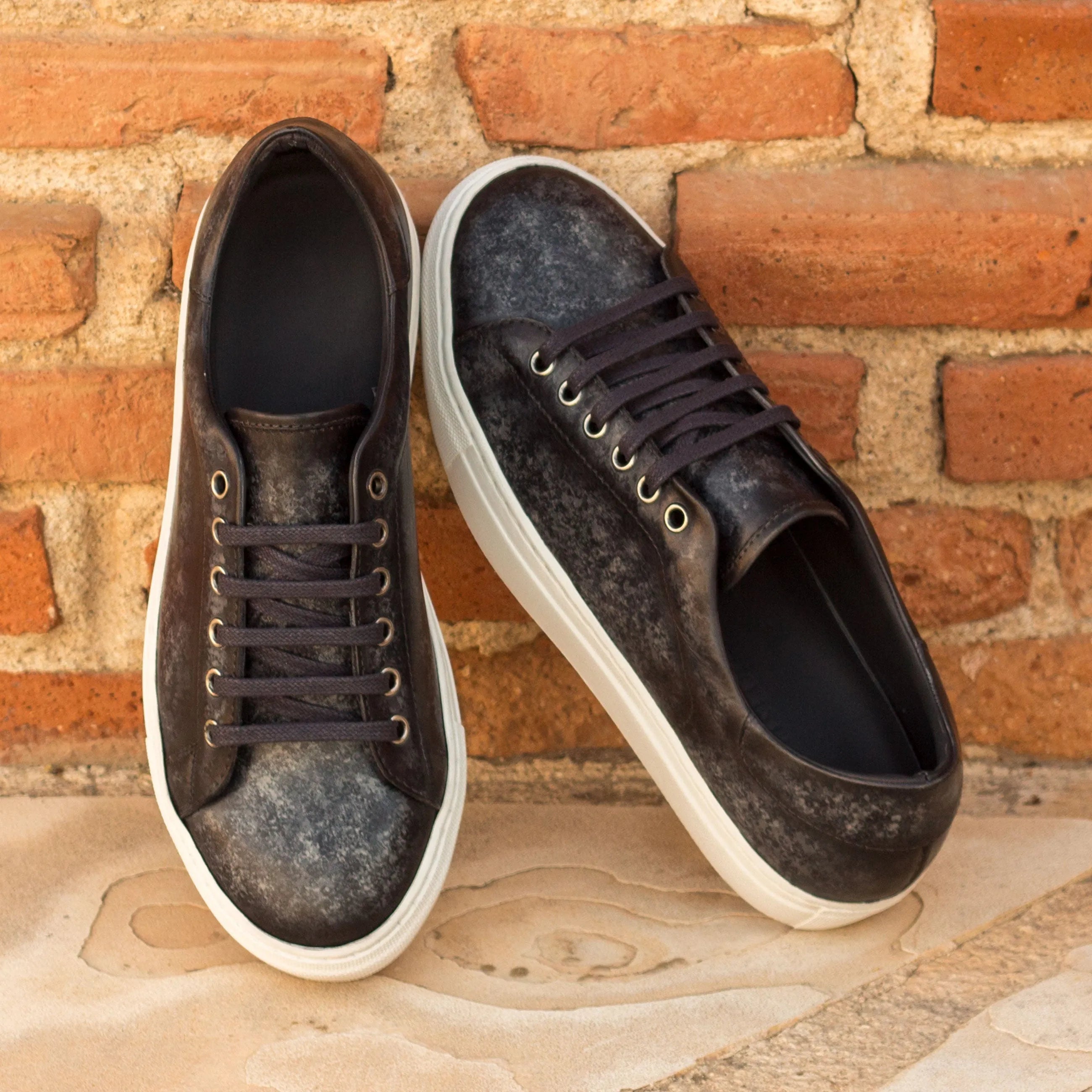 Pair of black leather Sancho Trainer Patina cupsole trainer sneakers