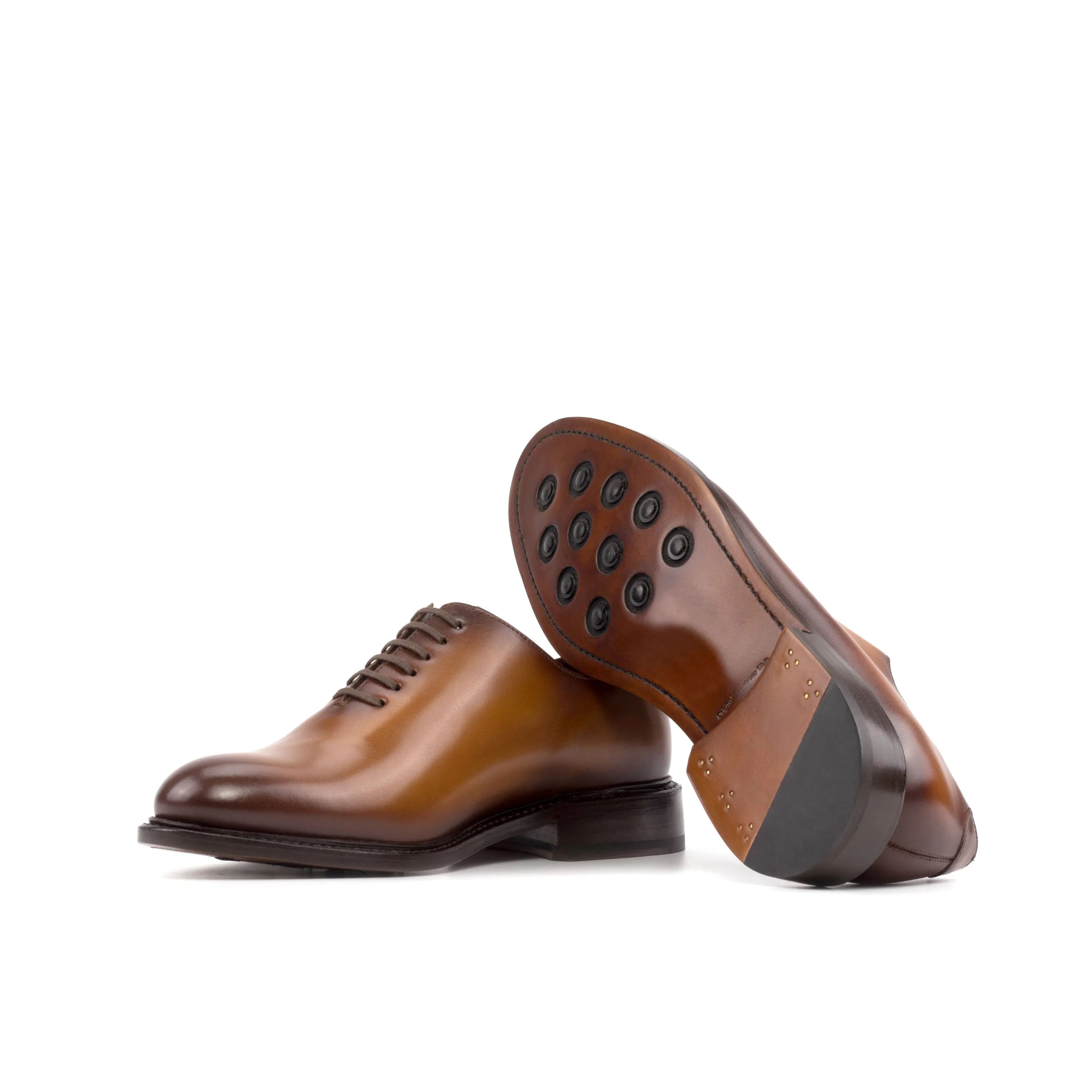 Pair of brown leather Stellar Wholecut shoes