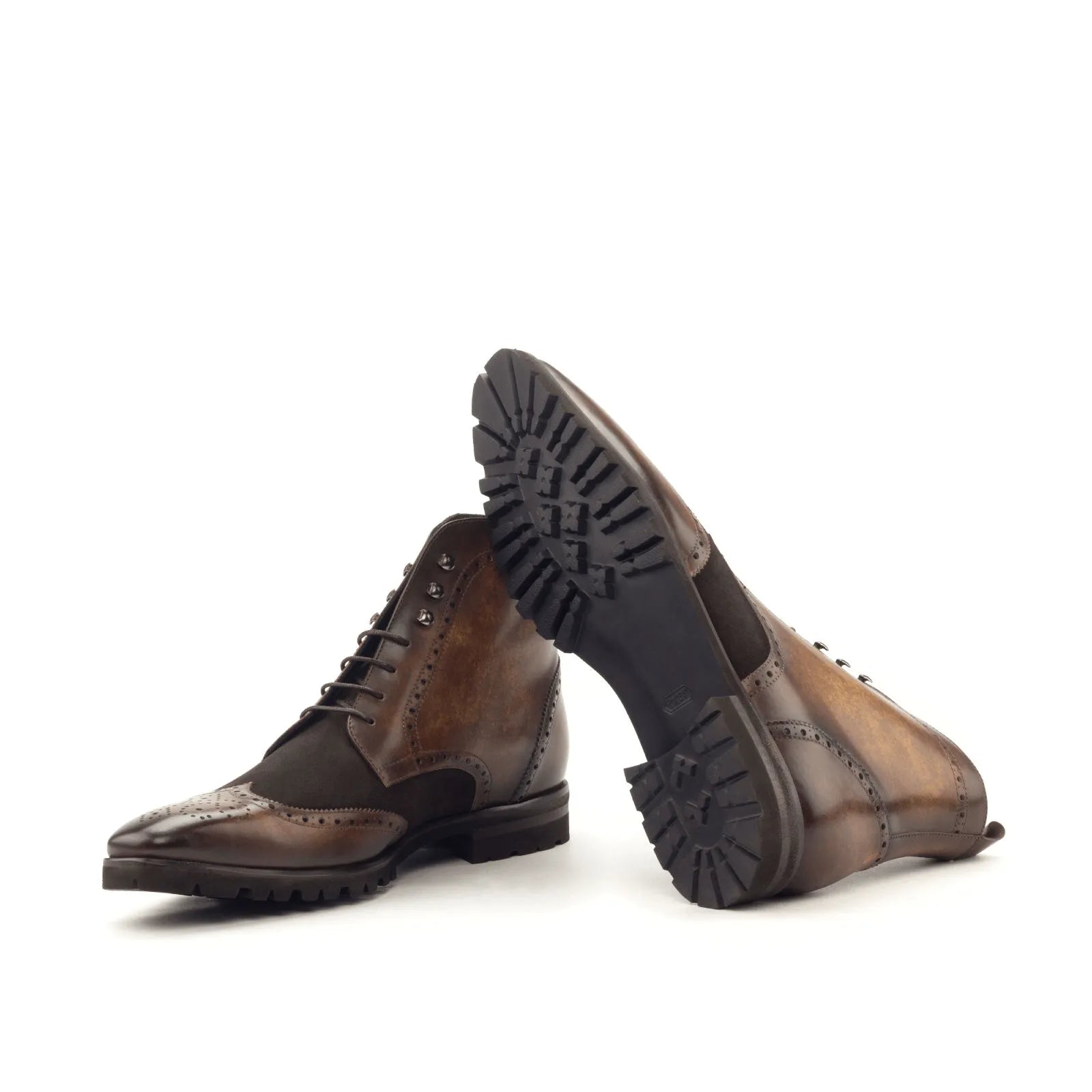 Theron military brogue boots in brown leather wingtip with patina