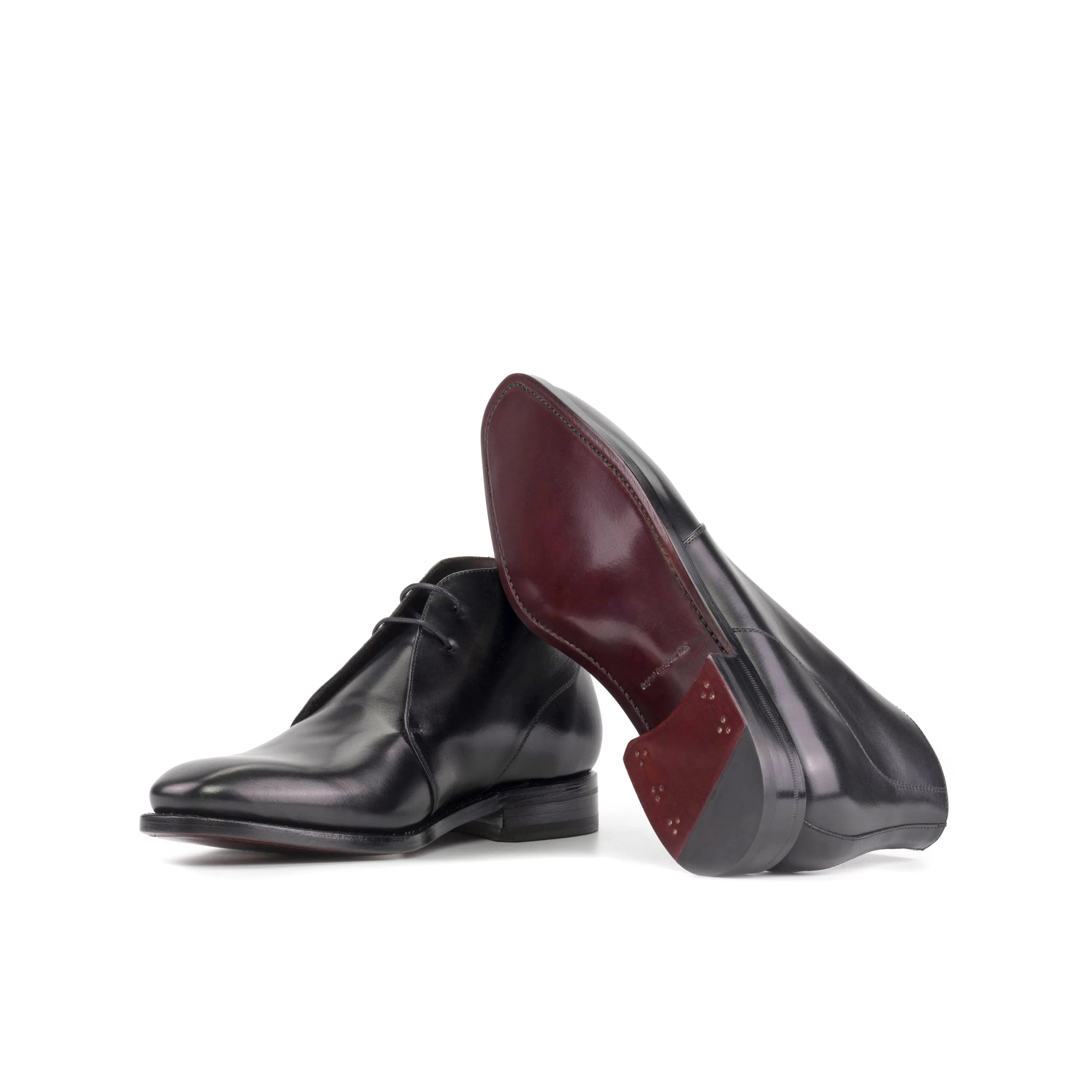 Pair of black leather Winsor Chukka boots, back view