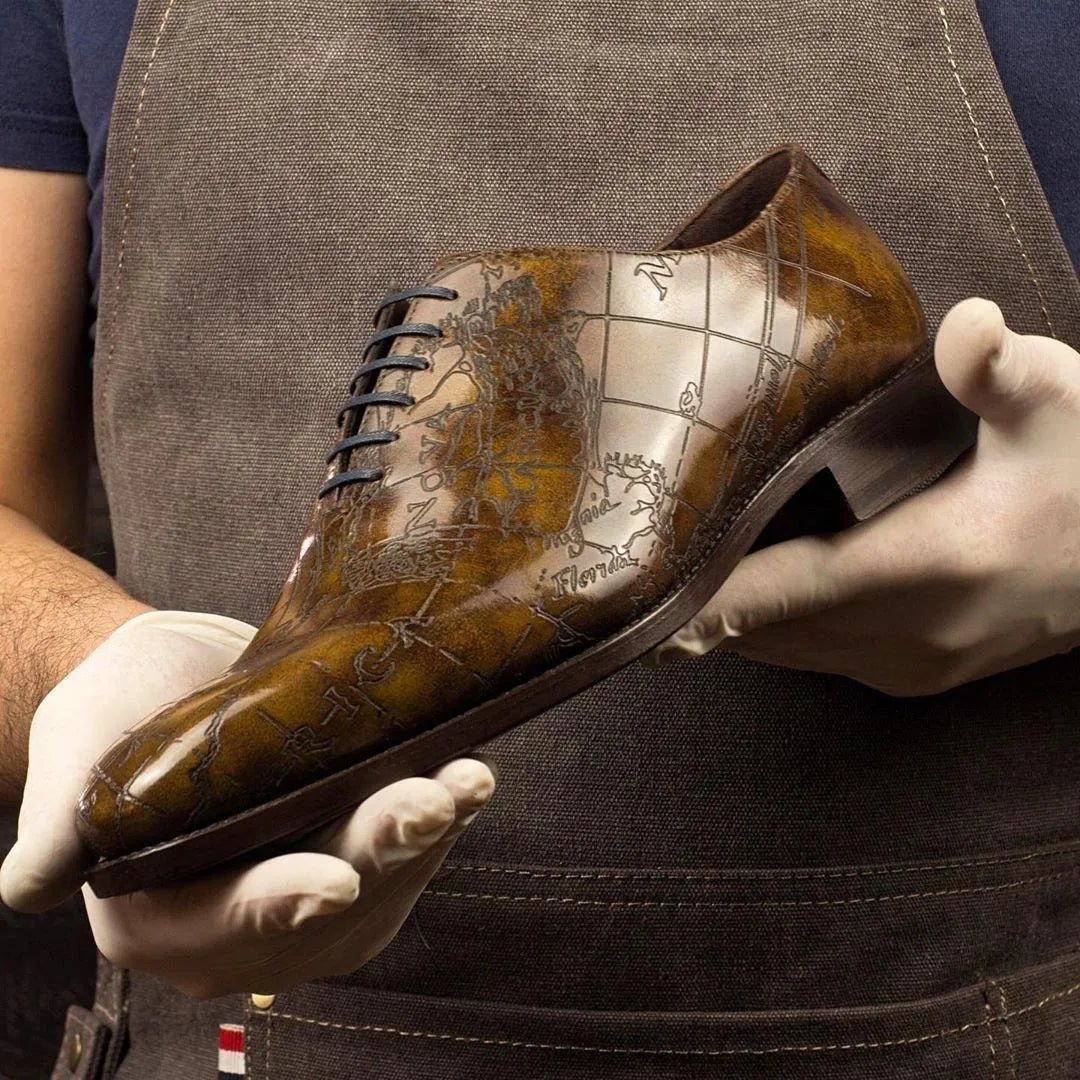 Worldly Patina Wholecut II brown leather dress shoe with map design